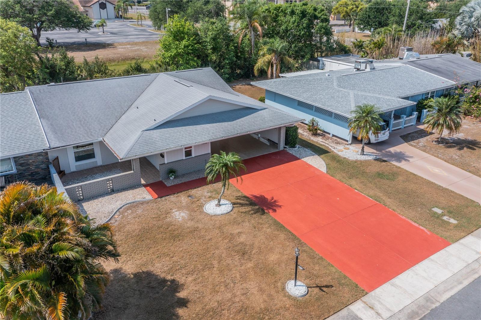 FRONT OF HOME SHOWING COURTYARD AND 2 CAR CARPORT