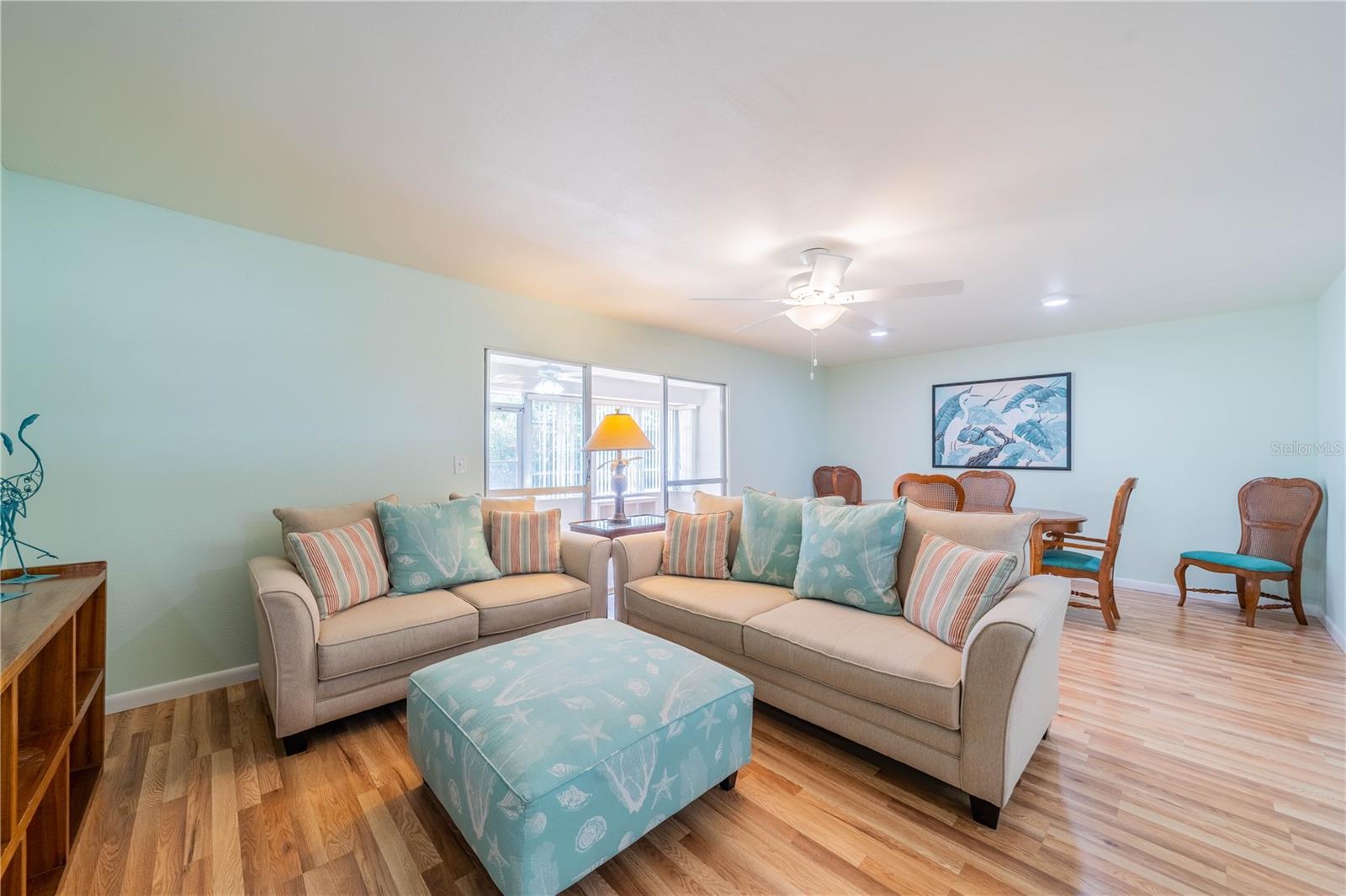 LIVING ROOM AND DINING AREA WITH NEW CEILING FAN AND LIGHTING