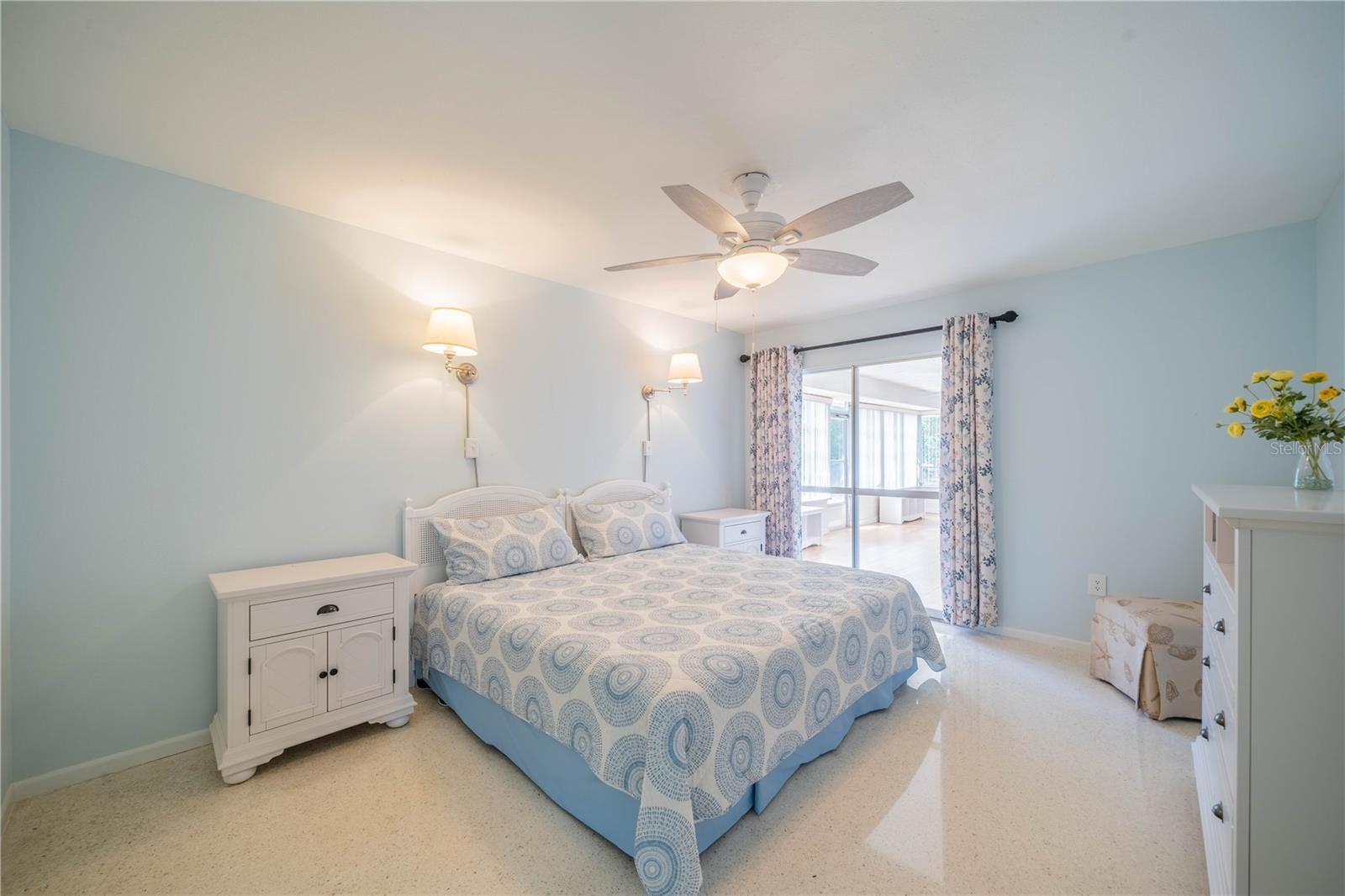 MASTER BEDROOM HAS TERRAZZO FLOORING AND NEW CEILING FAN