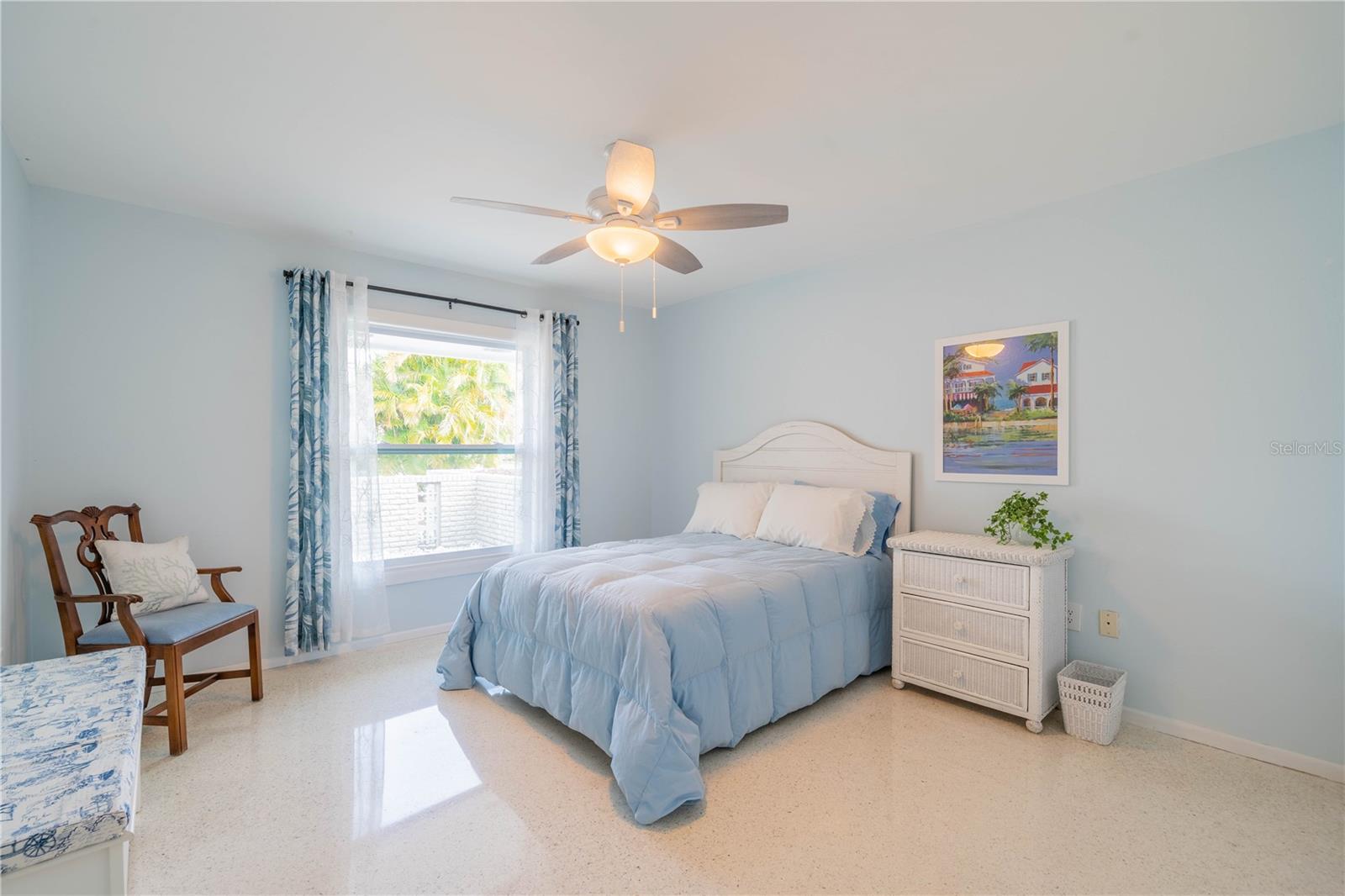 GUEST BEDROOM WITH BEAUTIFUL TERRAZZO FLOORING AND NEW WINDOW