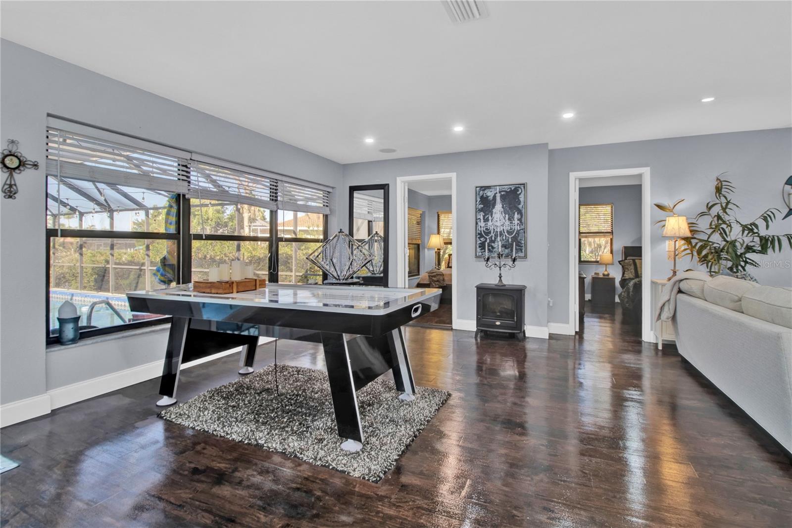 dining / current game room - dark wood floors replaced with Grey LV Plank