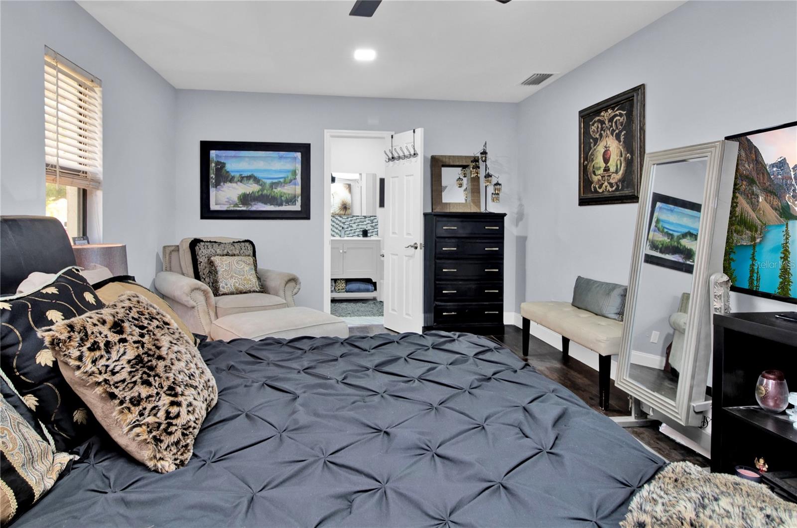 Primary bedroom -dark wood floors replaced with Grey LV Plank