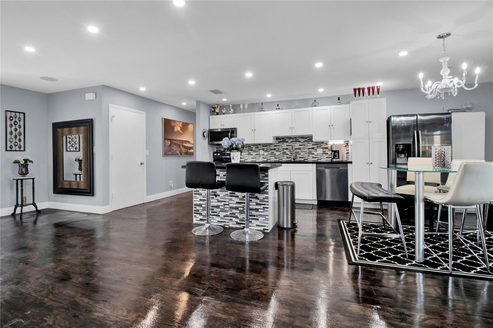kitchen - dark wood floors replaced with Grey LV Plank