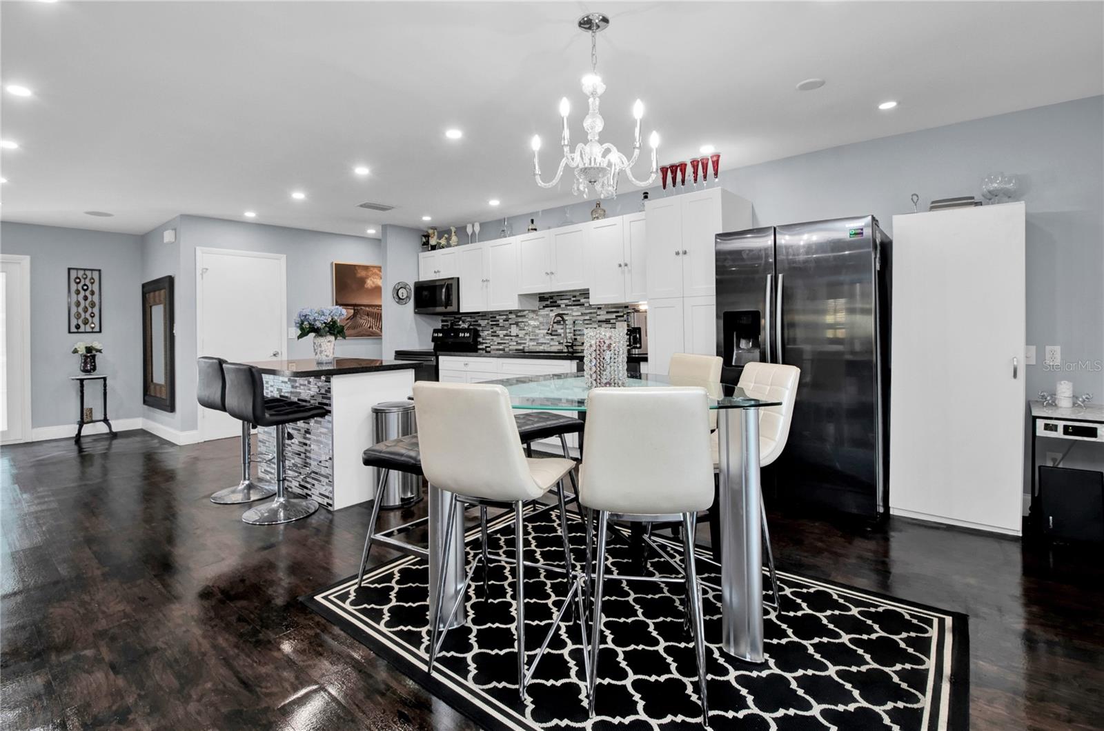 kitchen - dark wood floors replaced with Grey LV Plank