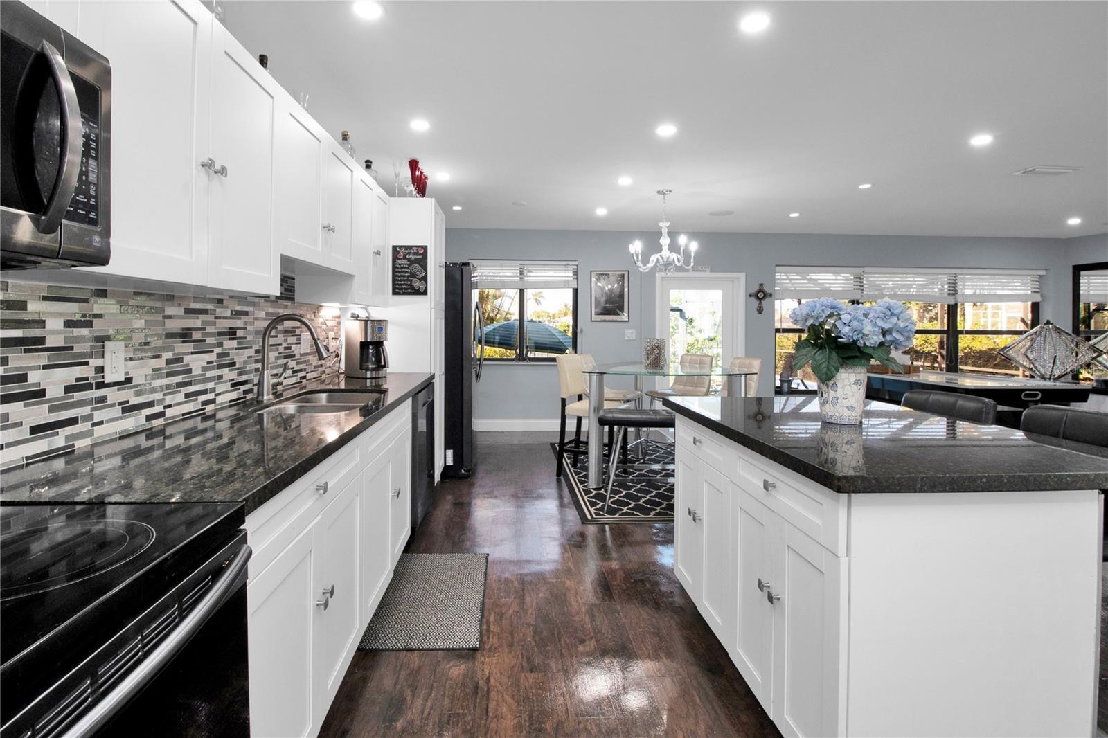 kitchen - dark wood floors replaced with Grey LV Plank
