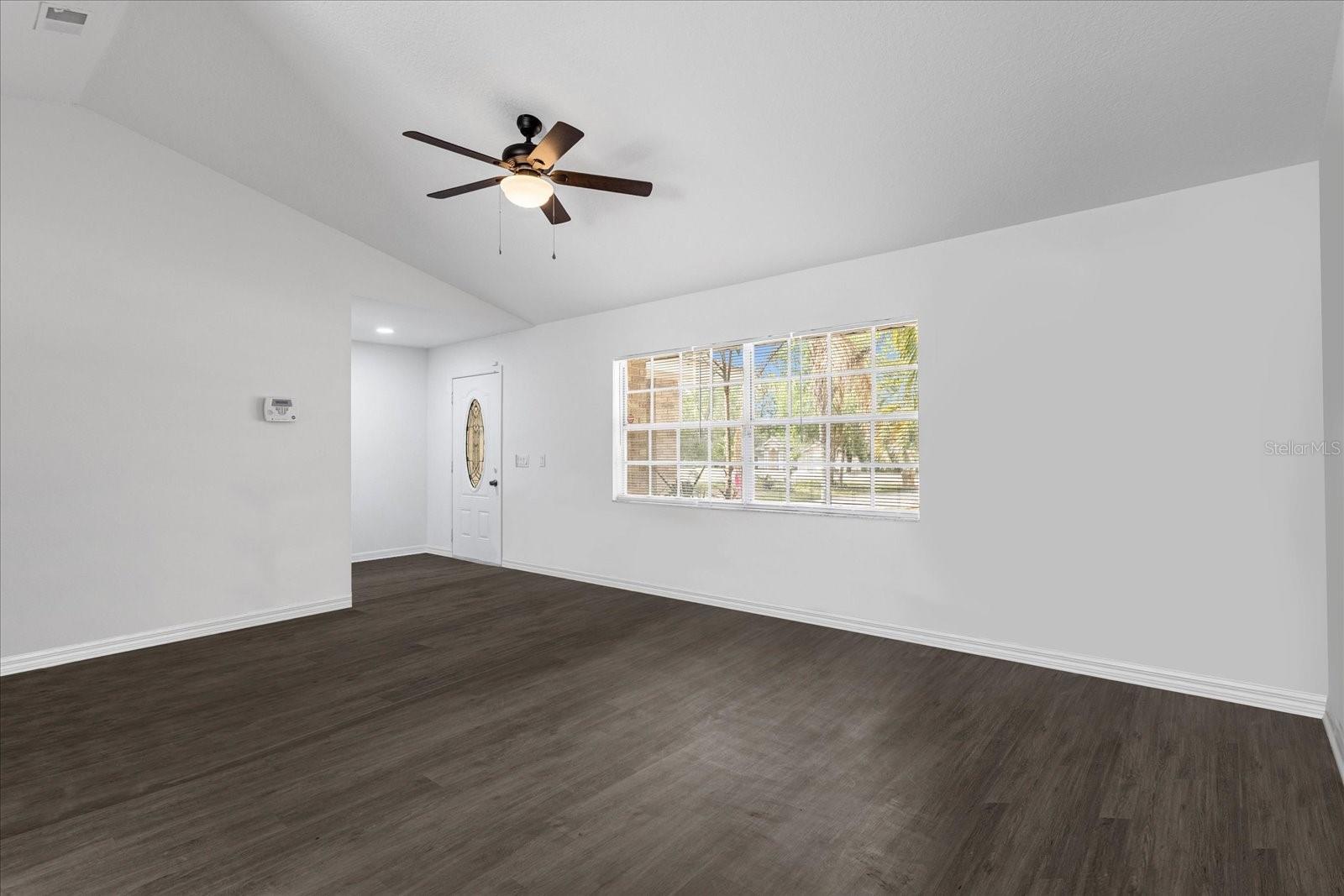 Foyer area and 18X13 Living Room with vaulted ceilings.