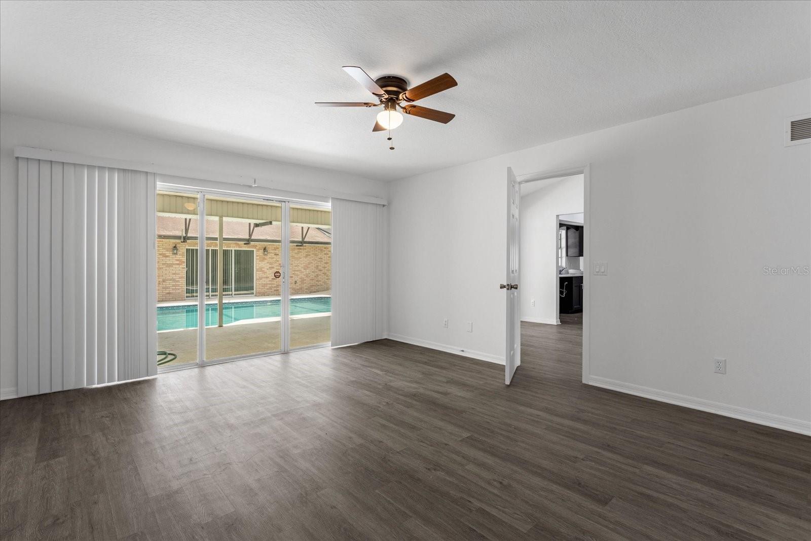 Primary bedroom with split floor plan on the front part of the home with en suite and 2 closets