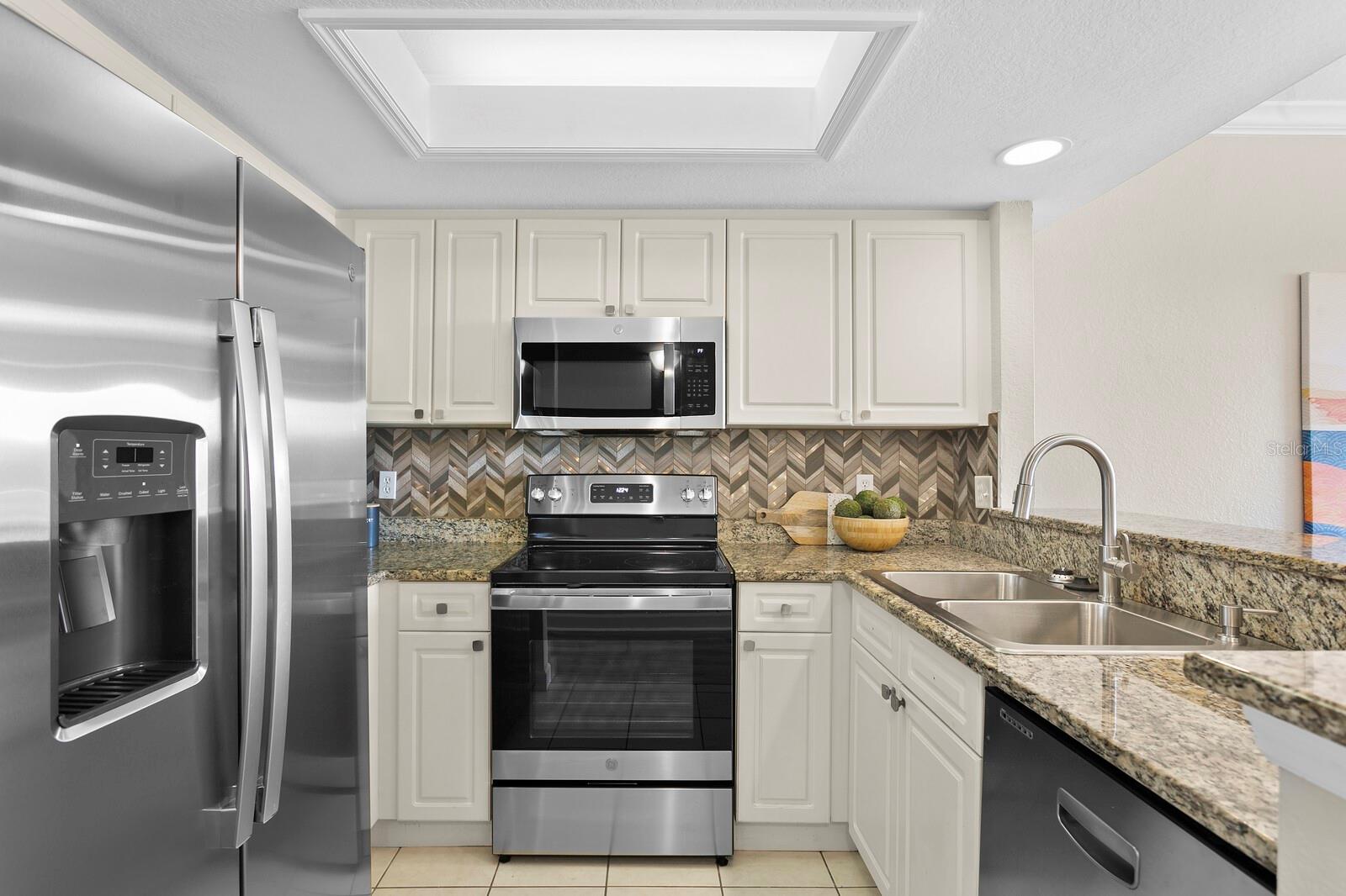 kitchen has all new stainless steel appliances