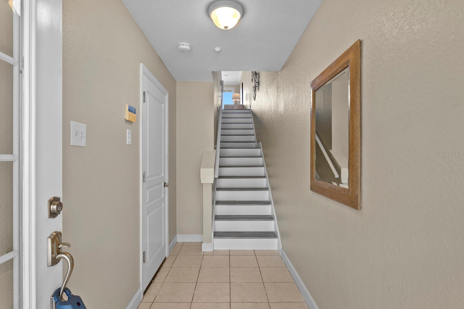 Entrance hallway.  Garage door to the left