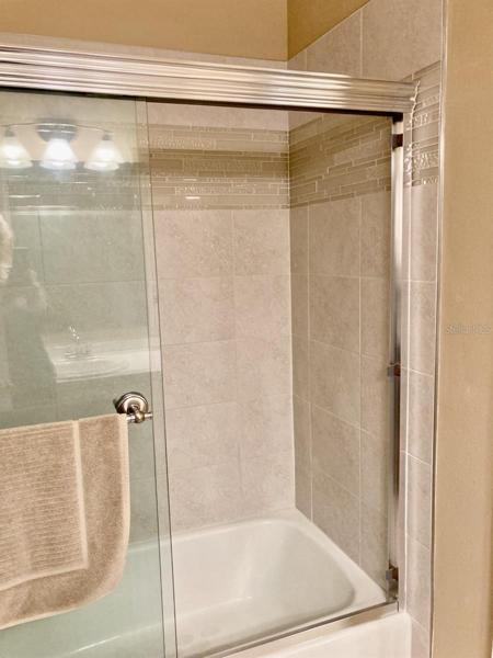 Second bathroom tub and shower.