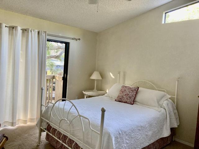 Second bedroom with sliding door to deck.