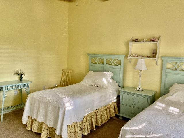 Bedroom has cathedral ceilings.
