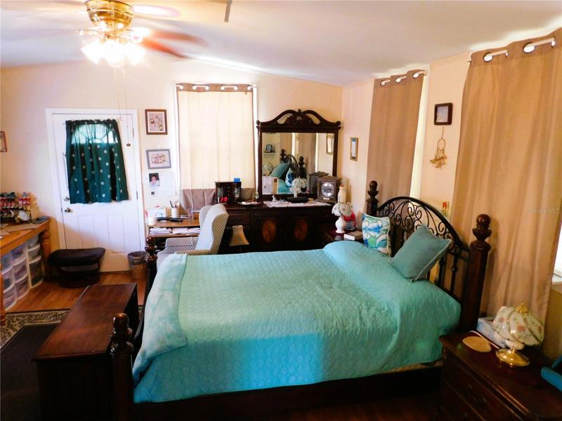 Master bedroom is located in back of this home.