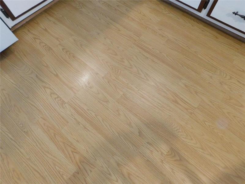 Laminate flooring in Kitchen, Bathroom, and Bedrooms.