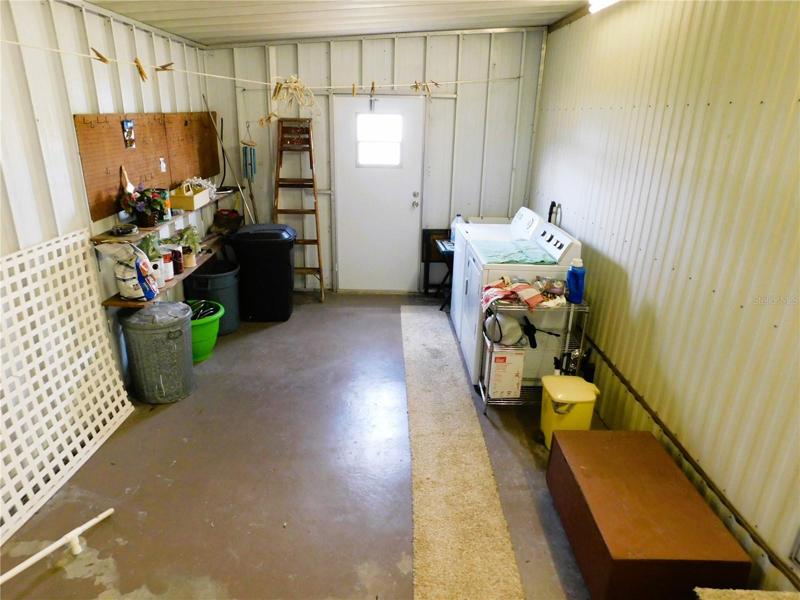 Large storage shed attached.