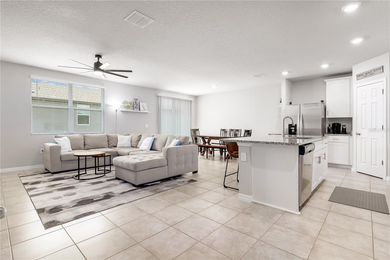 Open concept floor plan living room, dining room, and kitchen combo.