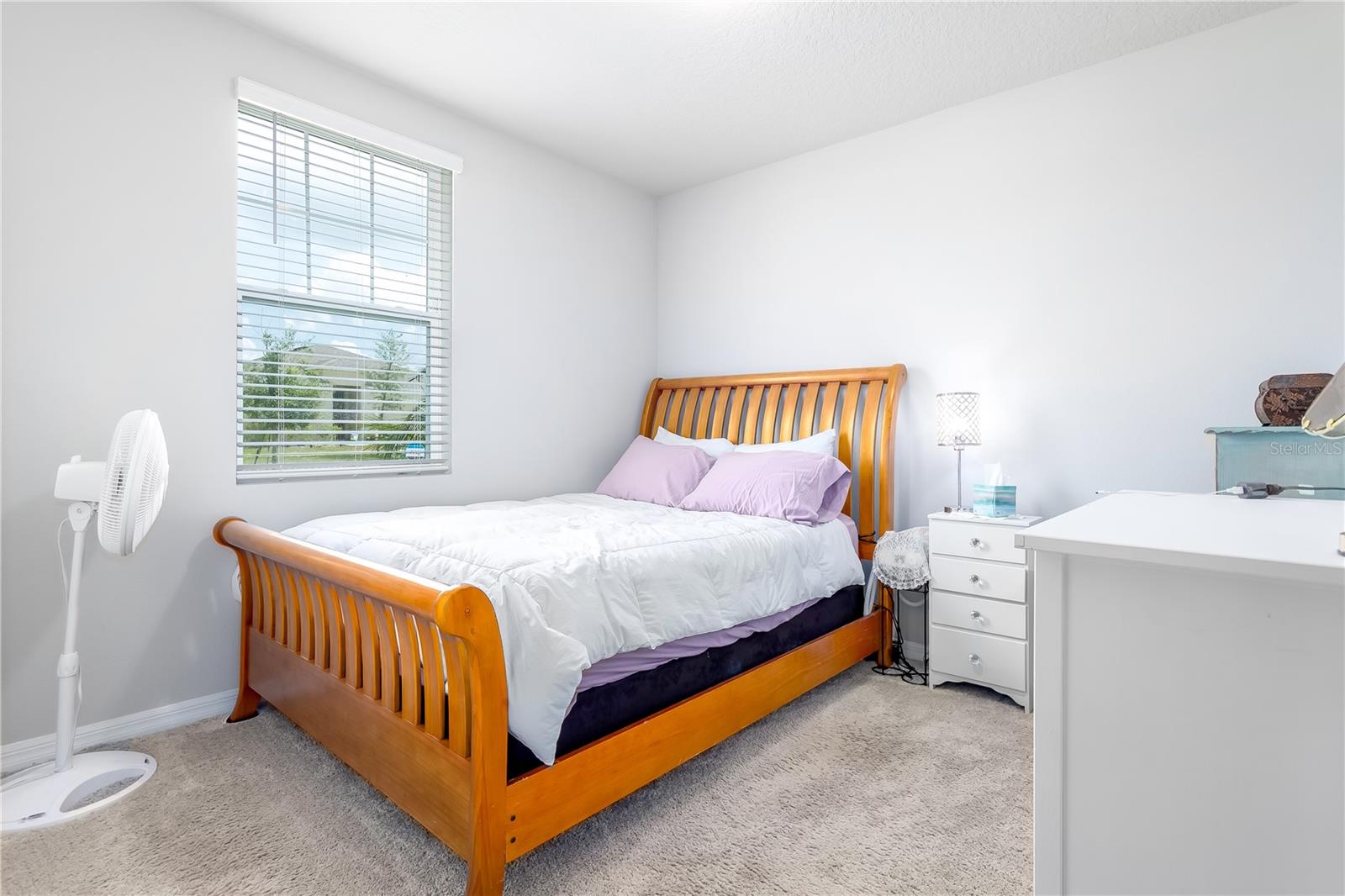 Guest bedroom 1, closest to the front door.
