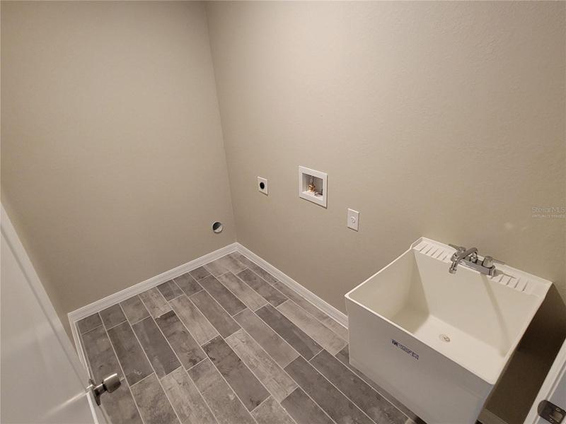 Virtually staged, this is a photo of a previous home of the same model built by the same builder. Features subject to change, buyer to verify.