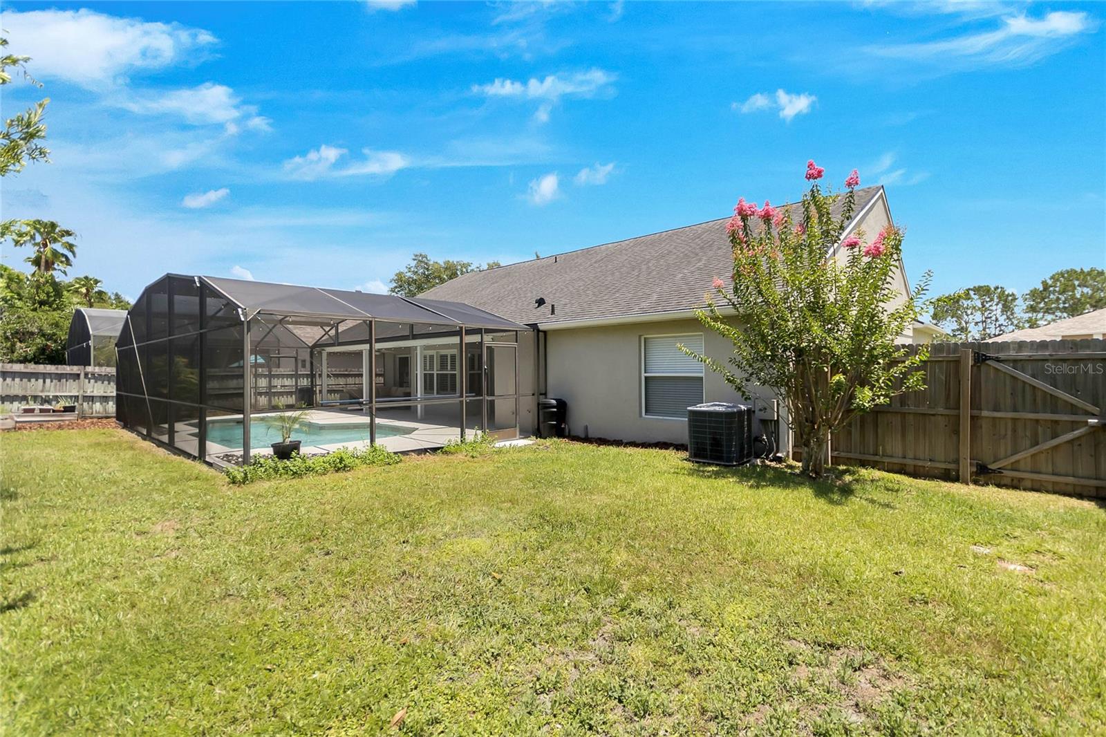Backyard is private and fenced but the property extends beyond the fence to the side of the home.