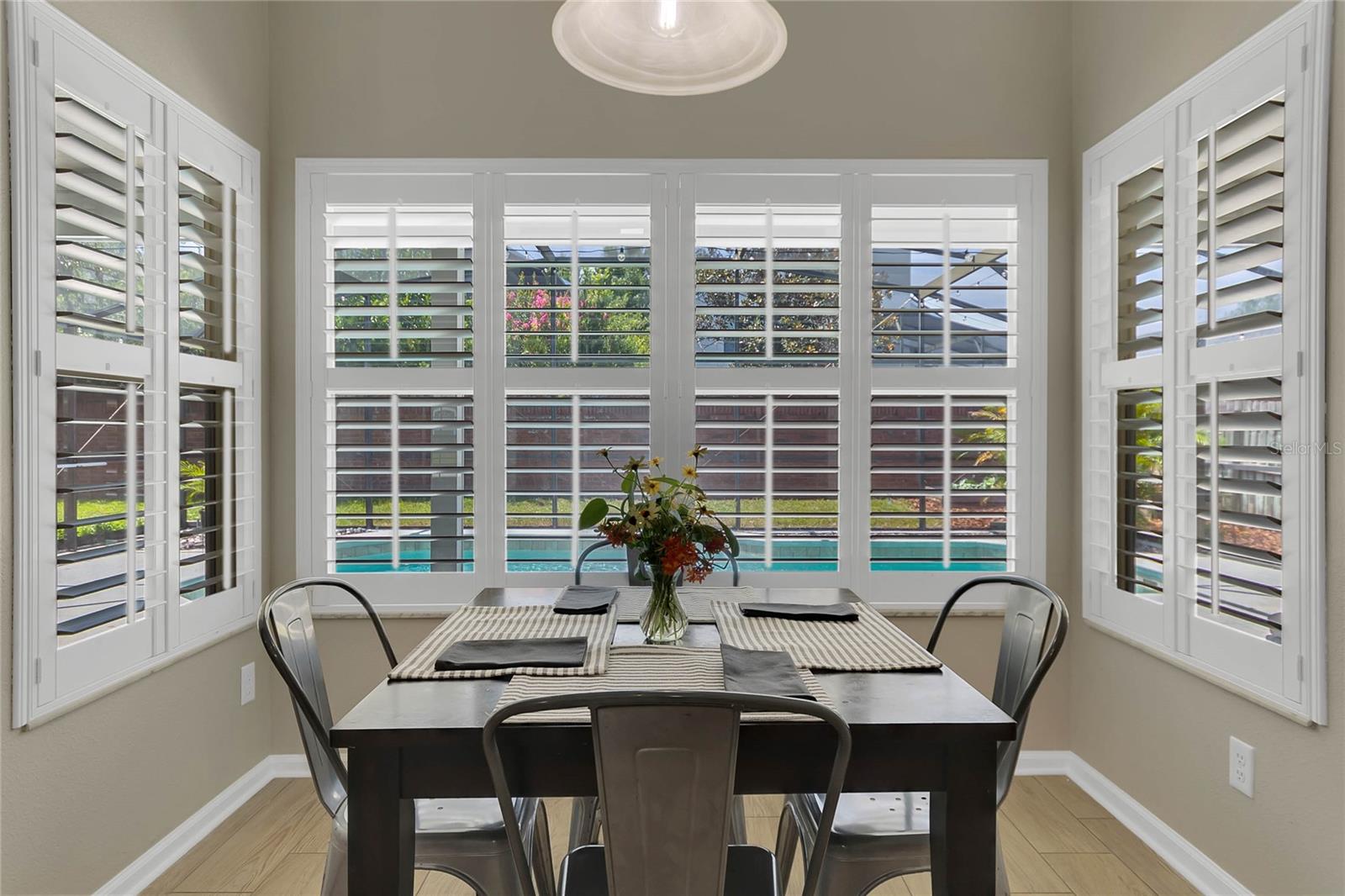 Breakfast Nook with pool view, plantation shutters