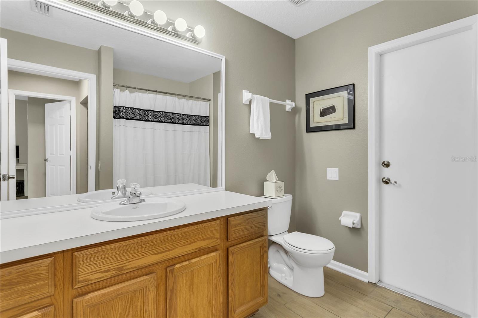 Full bath with access from family room and pool/patio for guests