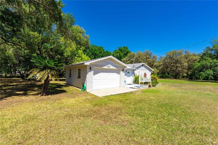Income property #2. Offers two bedrooms and two bathrooms with detached garage.