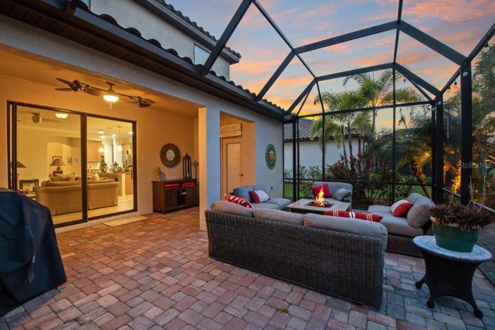 Extended paver Screened in Lanai with an additional extended exposed paver lanai with access to a half bathroom.