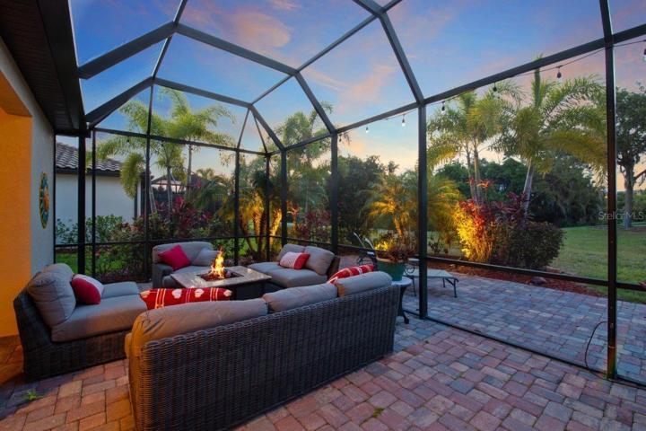 Extended paver Screened in Lanai with an additional extended exposed paver lanai with access to a half bathroom.