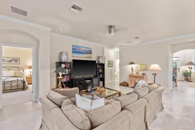 Bright and Open Living room down stairs in the Semi-Open Floorplan with access to the Owners Suite
