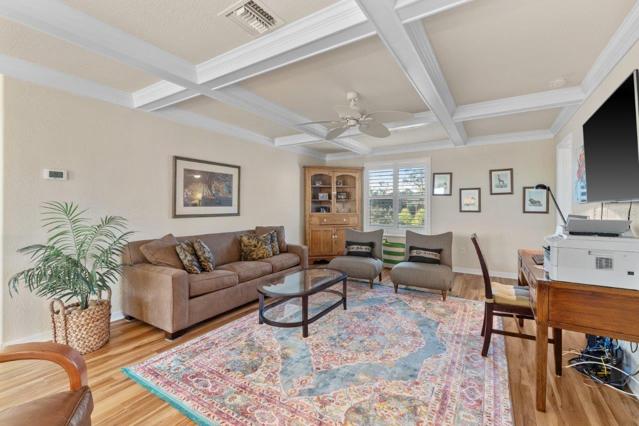 Upstairs Den featuring coffered ceilings and access to all 3 guest bedrooms