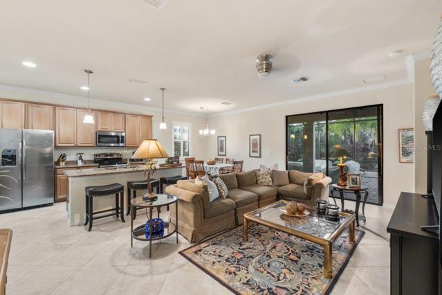 Bright and Open Living room down stairs in the Semi-Open Floorplan with access to the Owners Suite