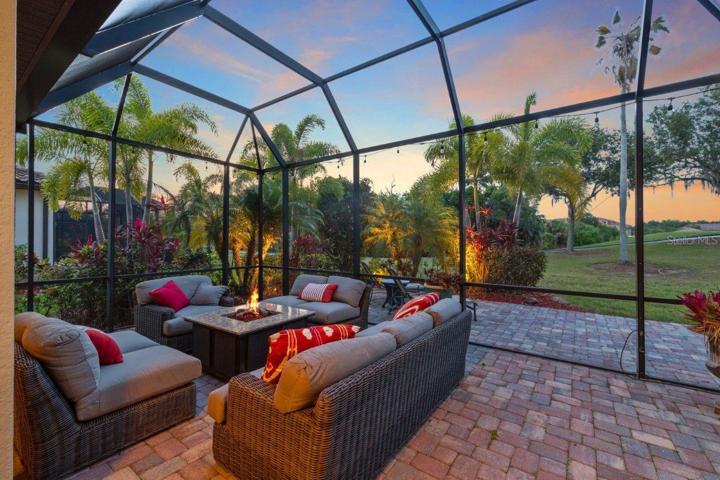 Extended paver Screened in Lanai with an additional extended exposed paver lanai with access to a half bathroom.