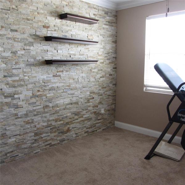 3rd bedroom - stone accent wall