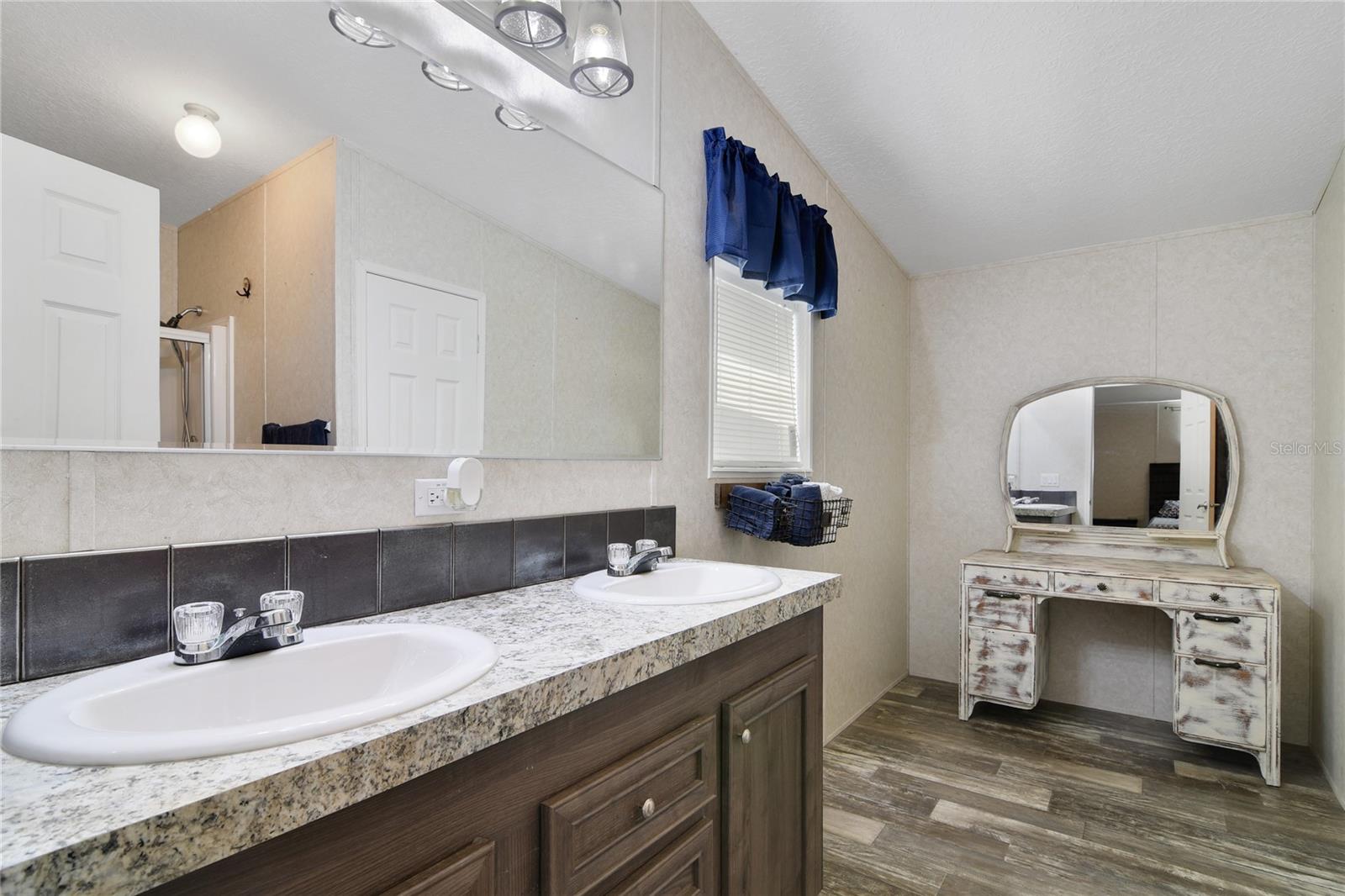 Primary bathroom with walk in shower and clothes closet