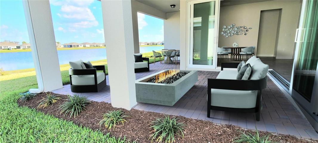 Virtually Staged- Large Covered Patio overlooks Lake