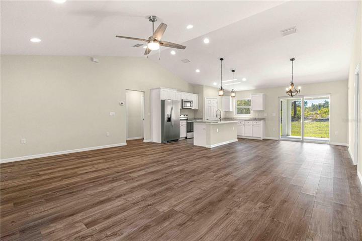 LIVING ROOM WITH VAULTED CEILING