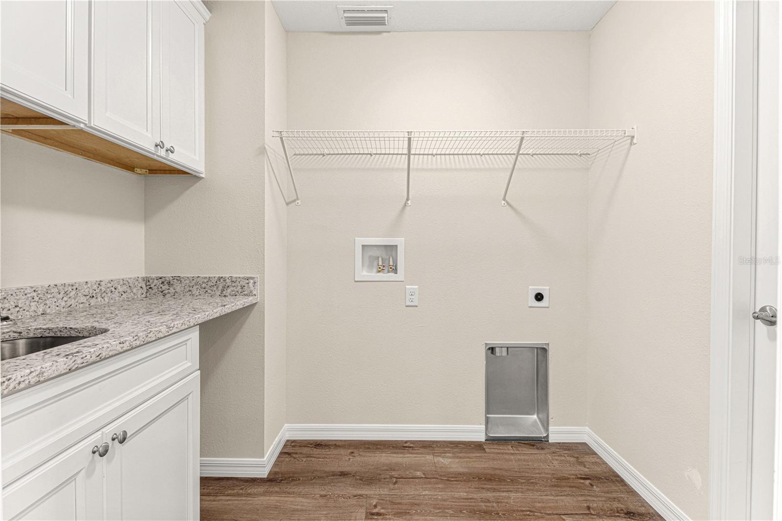 LAUNDRY ROOM WITH CABINETS, SINK,SHELVING AND GRANITE COUNTERTOP FOLDING BAR 