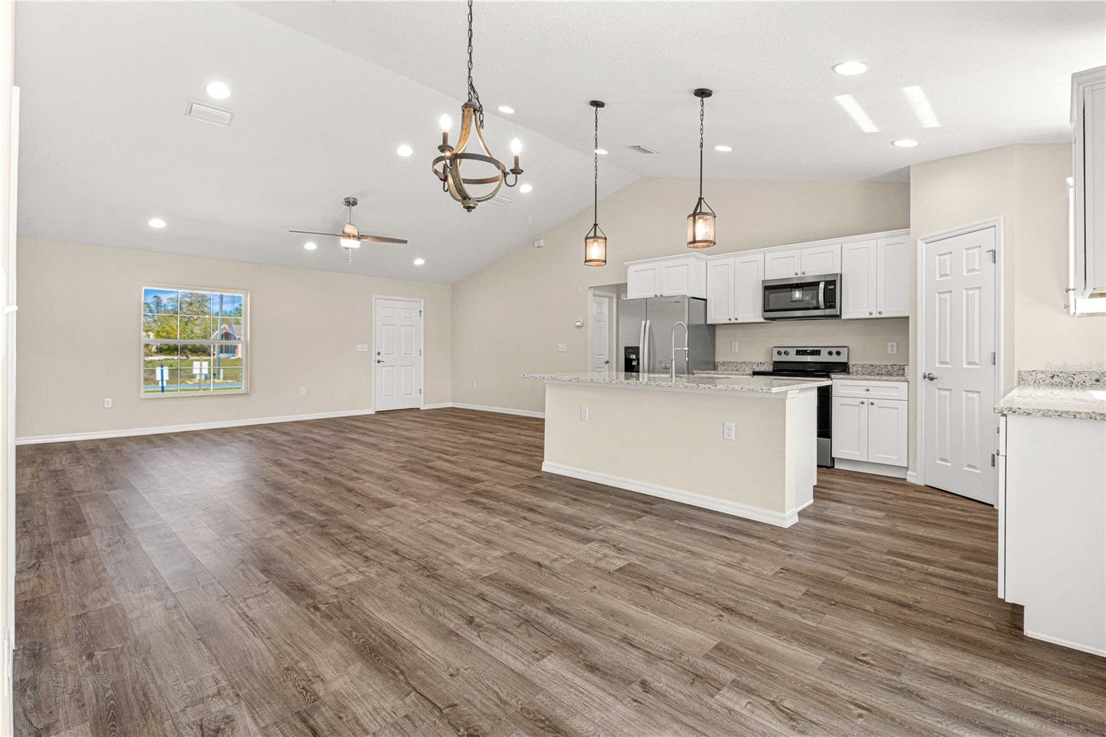 KITCHEN AREA WITH FRENCH DOORS LEADNG TO LANAI