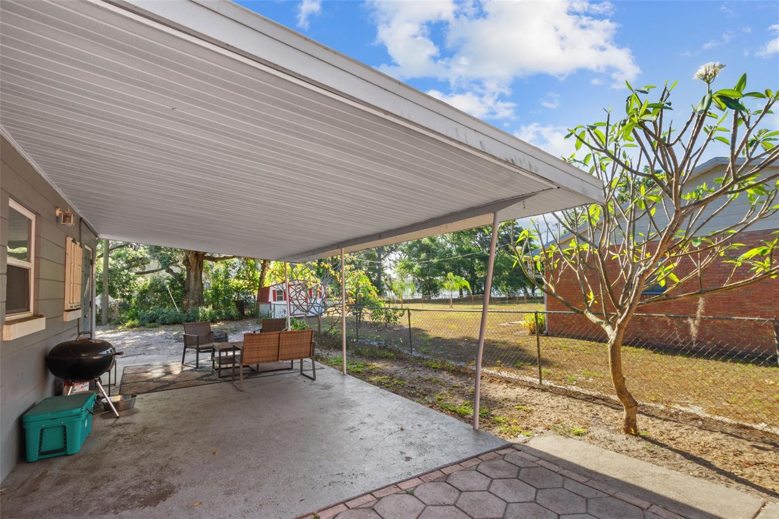 View of the lake from the outdoor sitting area or carport