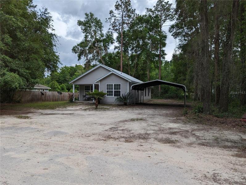Front entrance and 2 carport space