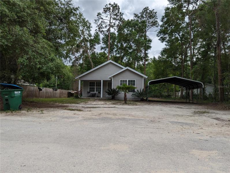 Front entrance and 2 carport space