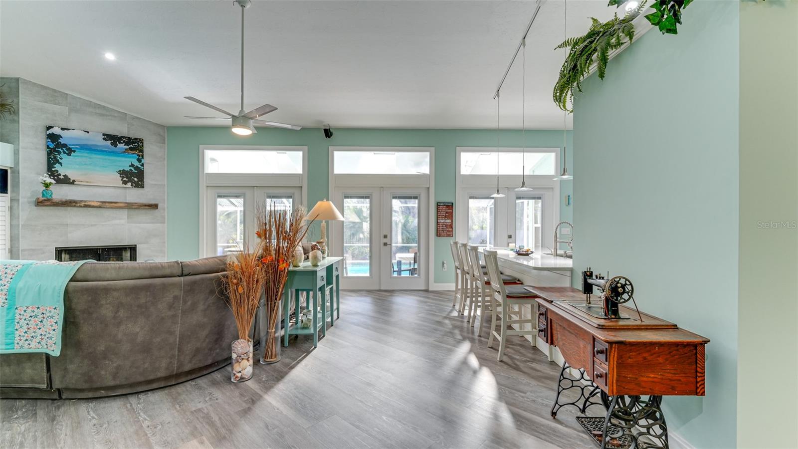 Open floor plan with coastal colors
