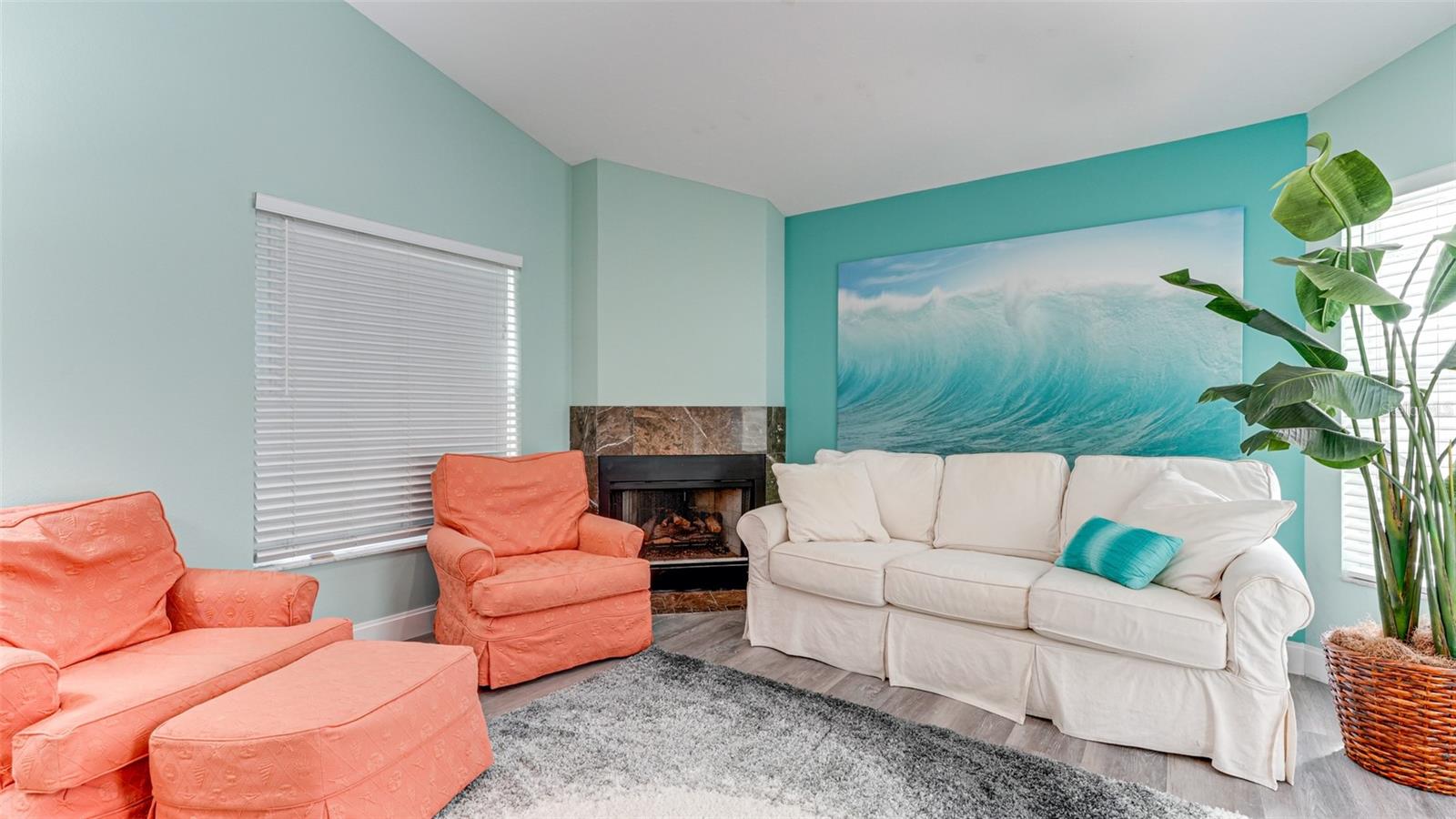 Sitting area with gas fireplace in master suite