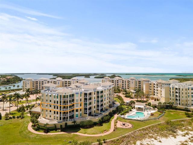 As outlined, this end unit condo enjoys lots of sunshine, beach and water views!