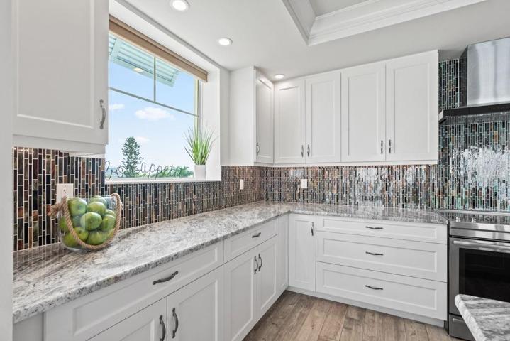 Plenty of counter space for food prepping and a gorgeous tile Backsplash!