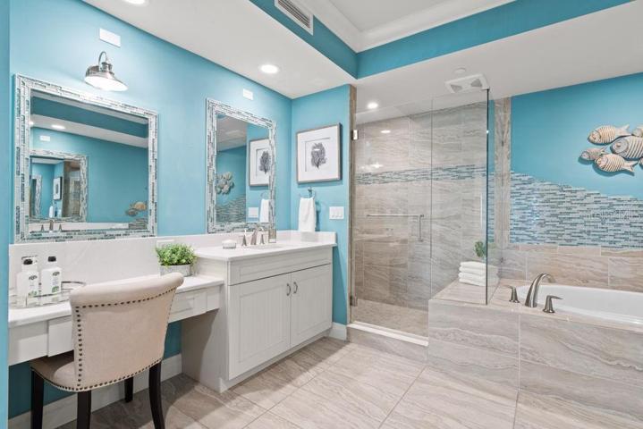 Dedicated vanity with a drawer and added recessed lighting.
