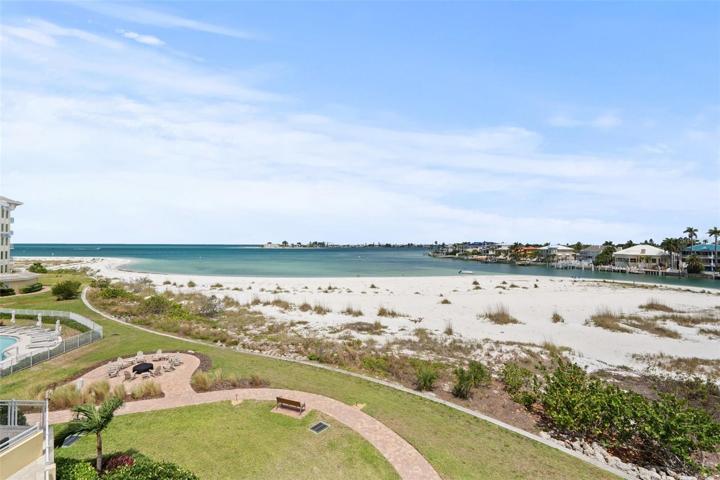 Amazing views from your balcony of the private beach, firepit and beachside pool.
