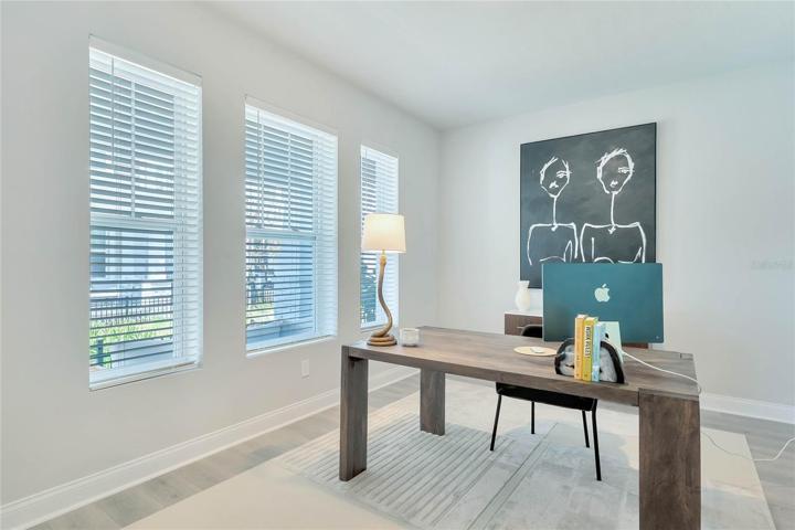Convenient downstairs study/den or flex space