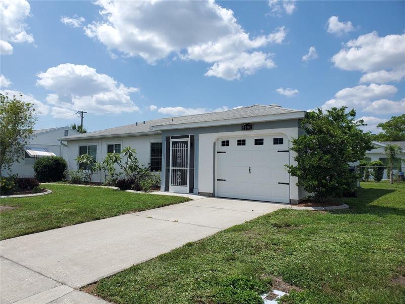 55+ community. Private road. Nice driveway and a garage