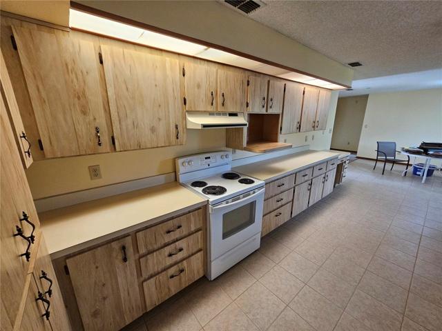 Kitchen stove side with lots of counter tops